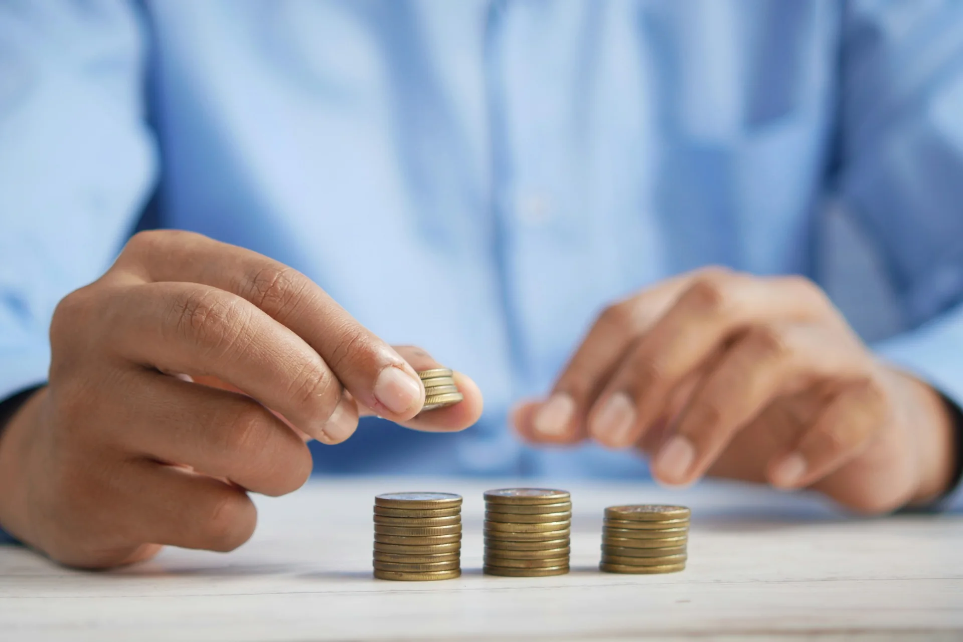Stacks of coins being counted for salaries